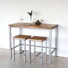 A conference room table built upon an old industrial machine base. Counter Height Reclaimed Wood Kitchen Table Pub Table What We Make
