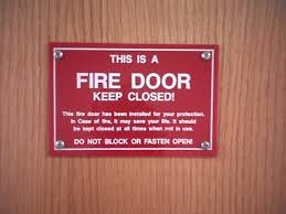 Tuscaloosa fire and rescue took a picture of a room after a fire broke out. Signage On Fire Doors I Dig Hardware