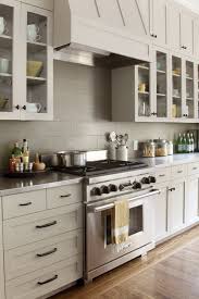 Subway Tile Backsplash And Glass Cabinets Kitchen Backsplash Trends Kitchen Cabinets Glass Inserts Taupe Kitchen