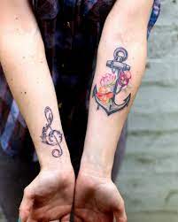 Traditional flowers with lighthouse and anchor tattoo design. 30 Floral Anchor Tattoos For Women Tattooblend