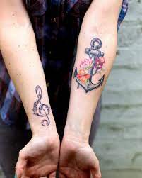Traditional flowers with lighthouse and anchor tattoo design. 30 Floral Anchor Tattoos For Women Tattooblend
