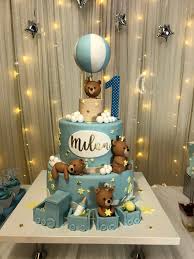The wedding couple is standing on the background of the order. First Birthday Baby Boy Birthday Cake Bear Baby Shower Cake Boy Birthday Decorations
