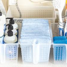 It's an odd shaped space and therefore there is not a one size fits all solution. Under Kitchen Sink Cabinet Storage Ideas On Sutton Place