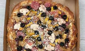 Mum wows with incredible pizza cake made from Woolworths mud cakes | Daily  Mail Online