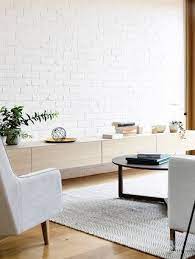 Exposed brick walls have long been a seen as a holy grail of interiors, the perfect solution for creating a stylish, yet understated feature wall look. Twin Peeks Clarence Houses White Brick Wall Living Room Brick Wall Living Room Brick Interior Wall