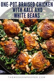 One Pot Braised Chicken With Kale And White Beans The Modern Proper Recipe Oven Chicken Recipes Dutch Oven Chicken Braised Chicken