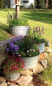 Sideryardgardens Nice Nice Rock Garden Landscaping Farmhouse Landscaping Backyard Landscaping Give old items a second life as garden structures or planters like organized clutter did with this bicycle in this farmhouse's garden is filled with all kinds of wonderful edibles.
