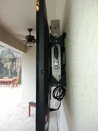 How To Mount Your Tv Outside And Hide The Cable Box And Wires Behind It Amazing House Design Tv Over Fireplace Wall Mounted Tv Hanging Tv