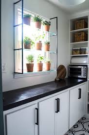 Even though the color is bold, the simplicity of the kitchen design—including the open wood shelving—stops it from becoming overpowering. Pin On Kitchen Design