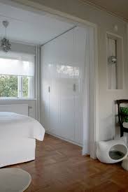 Ceiling Height Wardrobes Cat Bed Chandelier And The Disco Ball In An Unexpected Nook Bedroom Nook Roller Blinds Living Room Living Room Blinds