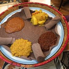 እንጀራ), a large sourdough flatbread, which is about 50 centimeters (20 inches) in diameter and made out of fermented teff flour. First Time Trying Ethiopian Food And First Time On A Date With A Fellow Vegan Made For A Pretty Great Day Vegan