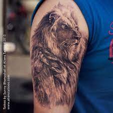 Lion Tattoo By Sunnybhanushali At Alienstattoo Mumbai Www Alienstattoos Com Original Tattoos Tattoo Universe Customcurseart Tattoo Artists Ink Offic Realistic Lion Tattoo Lion Tattoo Animal Tattoos