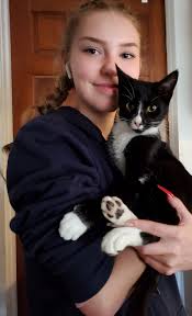 Adopted dog carried home by loving family