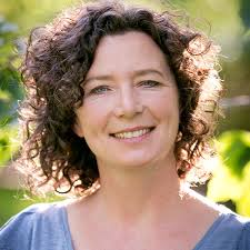 Slim body of woman in white lingerie on beige, female with perfect figure showing her flat smooth belly. Melissa Lockman Lcsw Somatic Experiencing Practitioner Psychotherapist Boulder County Colorado