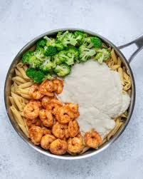 Creamy shrimp pasta with mushrooms in a homemade alfredo sauce. Healthy Broccoli Shrimp Alfredo Recipe Healthy Fitness Meals