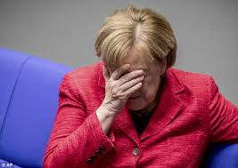 The german chancellor and us president posed for the press in the oval office. Angela Merkel Puts Her Head In Her Hands In Bundestag Daily Mail Online
