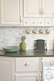 Shaker kitchen cabinets are a popular trend in current kitchen renovations because of the classic and simple look they give to either a traditional or contemporary design. Marble Subway Tile Backsplash With Jet Mist Honed Granit White Shaker Cabinets St Creative Kitchen Backsplash Kitchen Backsplash Farmhouse Kitchen Backsplash