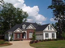 Now you guys know that i love a white house! Two Story Residential Home With Brick And Board Siding On The Brick House Colors Red Brick House House Paint Exterior