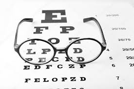 Glasses On Eye Chart Close Up Stock Photo Belchonock