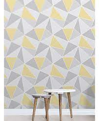 This Apex Geometric Wallpaper In Tones Of Yellow And Grey Features A Contemporary Geometric Pattern With A Geometric Wallpaper Wallpaper Bedroom Home Wallpaper