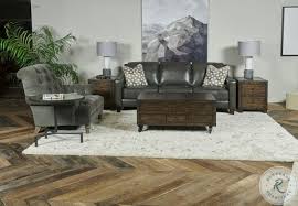 The top has three compartments, including a large right side compartment, room for wine bottle storage on the right side, plus a smaller center compartment. Hidden Treasures Brown Trunk Coffee Table From Hammary Coleman Furniture