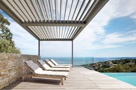 A louvered pergola is a newer style of pergola roofing that provides more effective shade from the sun by using angled, diagonal roof slats. The Modern Version Of A Pergola For Contemporary Garden Design Iq Outdoor Living