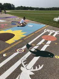 Begin by sweeping the area, as any dust will just ruin your work. Creativity Marks The Spot Painted Parking Spaces Provide Funds And Family Time Education Kenoshanews Com