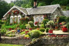 A quaint garden house, white fences, and raised beds for growing vegetables give this corner of chip and joanna's property country. Beautiful Garden House Images Home Designs Inspiration