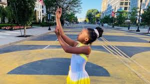What it looks like 01 black lives matter plaza street sign. 9 Year Old Girl Skates Across Black Lives Matter Plaza To Inspiring Rise Up Song Gma