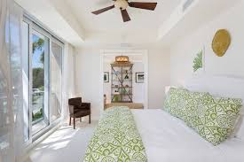 Your bedding is a great way to casually incorporate elements you love into your bedroom. Accent With Green Pattern Tropical Bedroom Ideas Tropical Room Decor Ideas