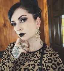 I will always be wearing giant earrings and lots of jewelry. But I have a  constant push/pull between nude lips and red. But now I'm bringing black  back into the mix and