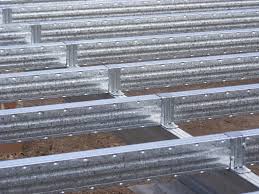 Close Up Of Joists Attached To Underbearer Using Top Hat Brackets Steel Frame Construction Steel Frame Steel House