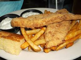 The outside might be crisp, but the fish is tender and flaky! Southern Fried Catfish Catfish Dipped In Buttermilk And Dredged In Corn Flour Then Deep Fried To A Crispy Golden Brown Served With A Side Of Cornbread French Fries And Tartar Sauce