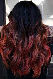 Use the curling iron to get long, sensual waves. 23 Ways To Rock Black Hair With Red Highlights Hania Style Black Red Hair Black Hair With Red Highlights Black Hair With Highlights