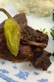 Mississippi pot roast is easy to make in the slow cooker with chuck roast, ranch dressing, au jus gravy mix, and pepperoncini peppers. Crock Pot Mississippi Pot Roast Recipe