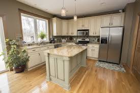 Green Kitchen Island With Cream Cabinetry Oak Floors Kitchen Renovation Design New Kitchen Cabinets Kitchen Renovation