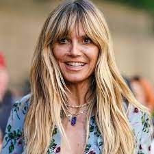 'we don't want to spread germs and risk others getting sicker'. Heidi Klum Gets Backlash For Topless Instagram Photo