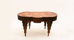 A mid century modern design, the amoeba coffee table offers a pleasing focal point to your space. Artek Amoeba Shaped Coffee Table Flower Stand