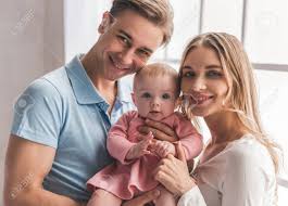 Free download cute baby wallpapers. Portrait Of Beautiful Young Parents And Cute Baby Looking At Stock Photo Picture And Royalty Free Image Image 72274205