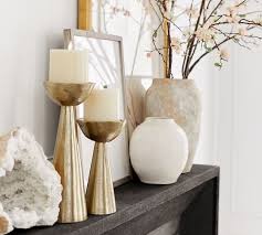 Coordinates with west elm's pillar candles (sold separately). Rough Cast Brass Pillar Candleholders Pottery Barn