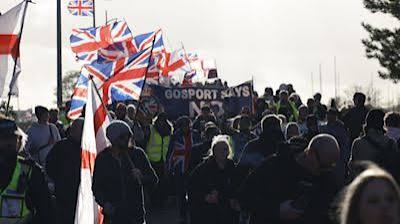 Hundreds join anti-migrant march near planned immigration removal centre | ITV News