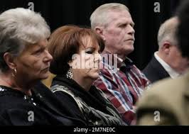 Debra Wyatt, center, the daughter of murder victims AJ and Patsy Cantrell,  listens Wednesday, Dec. 7, 2022, in Oklahoma City, for Scott Eizember, who  was convicted of several crimes and sentenced to