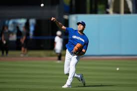 Dodgers' Shohei Ohtani throws off a ...