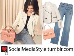 Selena Gomez S Coach White Leather Jacket Butterfly Embellished Peach Bag And Embroidered Jeans White Leather Jacket Embroidered Jeans Leather Jacket