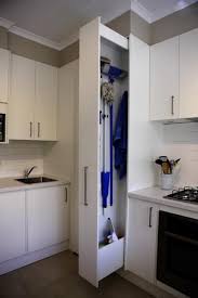 Maximize your space and buy a broom and mop holder, or build your own! Sliding Home Organizers For Mops And Brooms Space Saving Storage Solutions