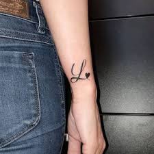 A tree tattoo beginning from the shoulder, moving into the far reaches of the forearm often symbolizes one's strong connection to the past or a strong family foundation. 40 Letter L Tattoo Designs Ideas And Templates Tattoo Me Now