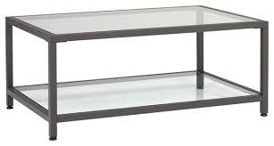 Think metal tables with clear glass tops and interesting bases. Camber 36 Modern Metal And Glass Rectangular Coffee Table In Pewter Clear Transitional Coffee Tables By Studio Designs Houzz