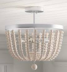 Beach house decorating ideas on a budget: 12 Coastal Chandeliers Under 250 Affordable Lighting For Your Home We Re The Joneses