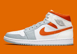 The Air Jordan 1 Mid Surfaces In Starfish Orange And Pure Platinum In 2020 Air Jordans Jordan 1 Mid Jordan 1