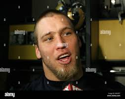 St. Louis Rams Brandon Green (L) and LaRoi Glover pull Arizona Cardinals  quarterback Matt Leinart down for a sack and a seven-yard loss in the third  quarter at the Edward Jones Dome